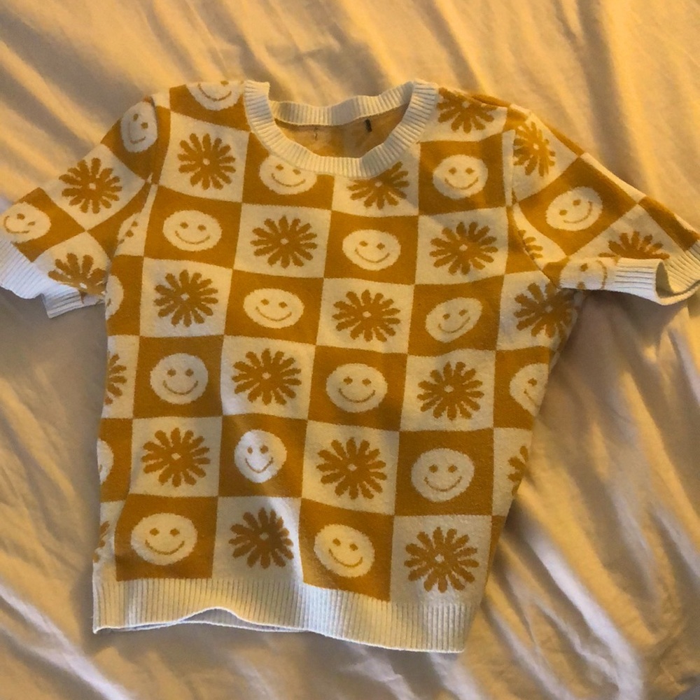 Yellow and white smile and flower checkered top